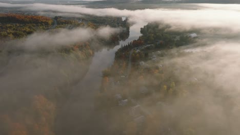 Foggy-Atmosphere-Over-Autumnal-Landscape-In-Sherbrooke-Town,-Quebec-Canada