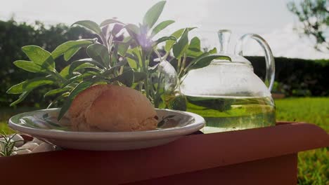 Afternoon-Tea-with-fresh-scone-made-with-of-Sage-leaves,-and-on-the-side-Sage-tea