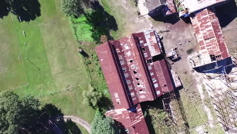 Top-Down-Aerial-View-of-Abandoned-Woodwork-Factory-in-Countryside-of-Argentina