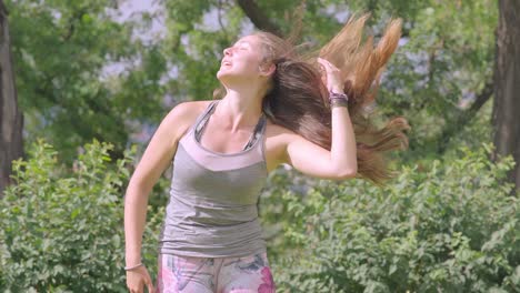 Young-Female-In-Sportswear-Flicking-Her-Long-Hair-Over-Shoulder-In-Slow-Motion