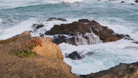 Mild-waves-crashing-over-coastal-rocks
