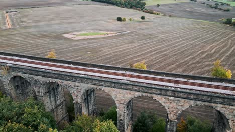 Aerial-footage-of-the-Penistone-Viaduct-a-curved-railway-viaduct-which-carries-the-Railway-over-Sheffield-Road-and-the-River-Don