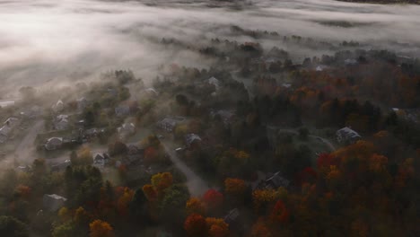 Colored-Trees-During-Autumn-With-Misty-Clouds-Over-Sherbrooke-Town,-Eastern-Townships,-Quebec-Canada