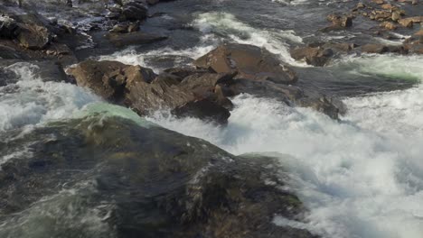 A-close-up-view-of-the-turbulent-waters-of-the-Gaula-river,-Norway