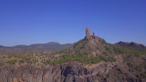 Cliff-forest-mountain-drone-flyover-view-of-Roque-Nublo