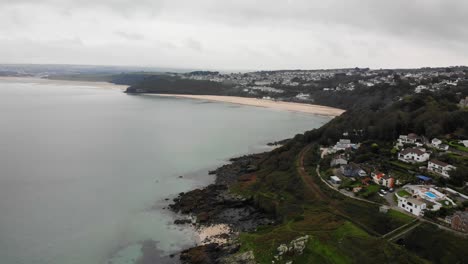 Forward-moving-drone-shot-from-Porthminster-point-looking-towards-Carbis-Bay-and-Hayle-Cornwall-England-UK