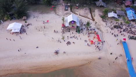 4K-DRONE-FOOTAGE-CHERATING-BEACH-PARTY,-MALAYSIA