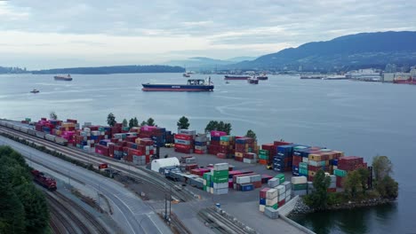 Beautiful-drone-aerial-shot-over-shipping-containers-and-industrials-ships-in-North-Vancouver,-British-Columbia,-Canada