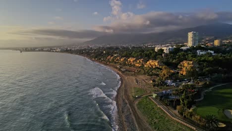 Aerial-view-of-urban-coastline-panning-into-the-sea