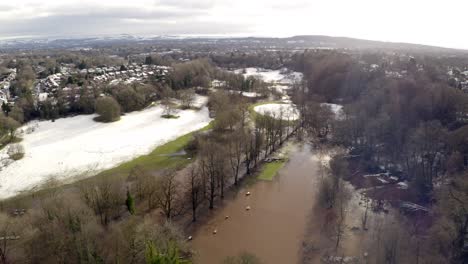 Aerial-footage-from-Drone-showing-the-river-Bollin-in-Wilmslow,-Cheshire-after-heavy-rain-and-with-burst-banks-and-flooding-surrounding-area