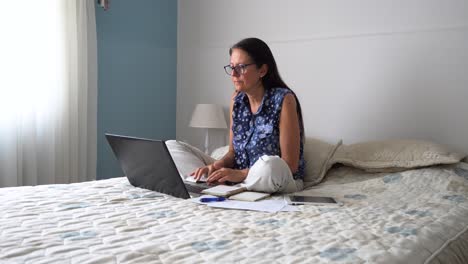 Middle-aged-woman-working-from-home-during-pandemic,-remote-working-on-laptop