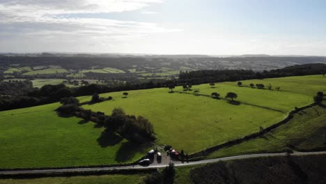 Forward-moving-aerial-shot-on-a-beautiful-sunny-morning-filmed-at-Hartridge-hill-part-of-the-Blackdown-Hills-Devon-England-UK