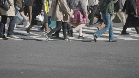 Legs-Of-People-At-Shibuya-Crossing-During-COVID-19-Pandemic-With-No-Tourist-In-Tokyo,-Japan