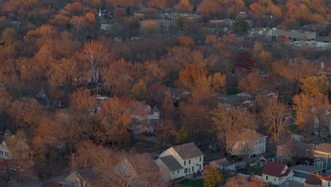 Pull-back-over-nice-houses-and-beautiful-Fall-color-in-charming-Kirkwood-neighborhood-at-golden-hour