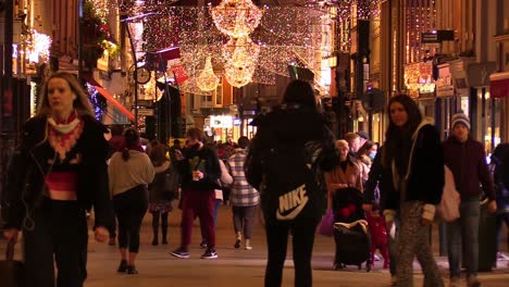 Still-shot-of-a-Dublin-street-at-Chrismas-time-in-hard-times-with-some-people-on-a-not-so-busy-street-and-local-businesses-closed
