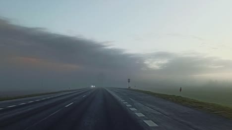 Driving-rural-countryside-road-in-the-misty-early-morning