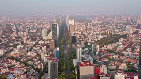 Aerial-birds-eye-view-flying-over-beautiful-cityscape-at-Reforma,-Mexico-City
