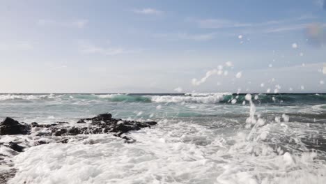 Waves-crashing-over-rocks-from-the-Atlantic-ocean-to-the-coastline,-Tenerife