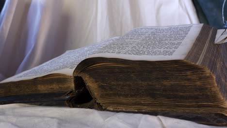 Old-Ancient-Bible,-Slider-Shot,-Close-Up