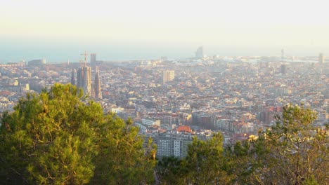 Handheld-shot-looking-down-at-the-city-of-Barcelona-on-a-bright-day