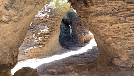 Inside-a-cave-at-Chiricahua-National-Monument-in-Arizona,-tilt-up-shot