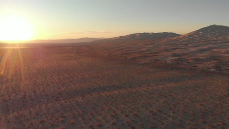 Aerial-view-ok-Kelso-dunes-in-California-during-an-amazing-sunburst-sunrise