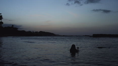 Wanderlust-Concept-of-Woman-Wading-in-Tranquil-Ocean-Water-in-Puerto-Plata