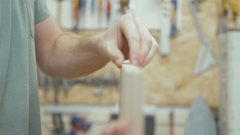 Carpenter-trims-white-oak-veneer-with-tool