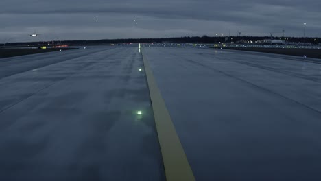 Plane-is-traveling-down-the-runway-of-an-airport