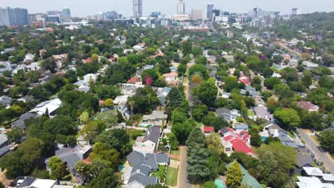 A-reverse-reveal-footage-of-the-city-of-Sandton,-Johannesburg,-South-Africa
