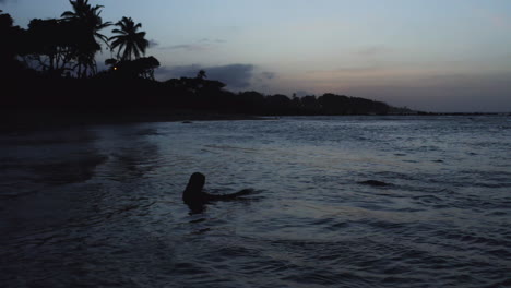 Silhouette-of-Person-Wading-in-Shallow-Beach-Waters-in-Puerto-Plata,-DR