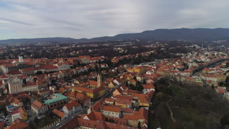 Zagreb-Cathedral-Flypast-And-Surrounding-City-Buildings,-Croatia