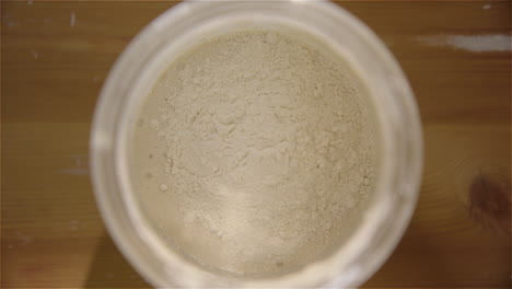 TOP-DOWN---Sourdough-starter-is-fed-with-flour-and-water