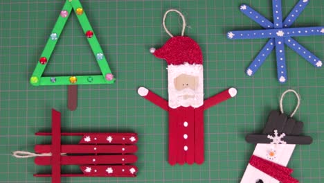 Christmas-ornaments-made-with-popsicle-sticks-on-a-cutting-mat