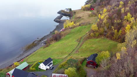 Typical-Autumn-Countryside-Landscape-With-Norwegian-Houses-By-The-Shore-Of-Fjord-In-Norway