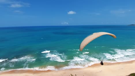 Paragliding-in-the-beautiful-tropical-Northeast-Brazil-on-a-warm-sunny-summer-day-near-Pipa-in-Rio-Grande-do-Norte,-Brazil