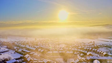 Aerial-Winter-Sunset-Snow-Covered-Rooftops-Of-Hemingfield,-Barnsley