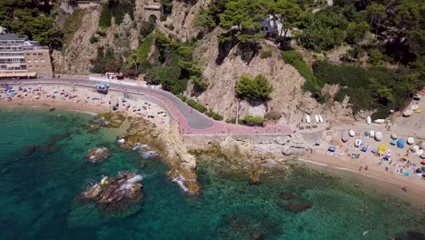 Clear-sea-of-Lloret-de-Mar-from-above-by-drone-zoom-out