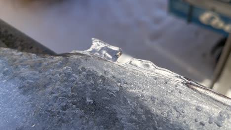 Crystalline-Frozen-Ice-On-Window-Ledge-During-Snowfall-Winter