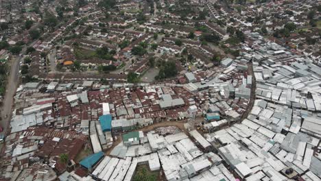 Aerial-view,-Kibera-slum-and-modern-residential-buildings-in-suburbia-of-Nairobi-Kenya