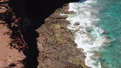 Drone-aerial-cliffside-beach-water-waves-summer-Hawaii