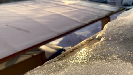 Frosty-Windowsill-During-Beautiful-Sunrise-In-Winter---Tilt-Up-Shot,-Selective-Focus
