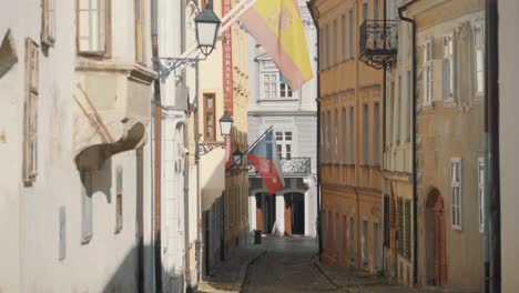 Traditional-historic-streets-in-Bratislava-with-national-flags-on-buildings