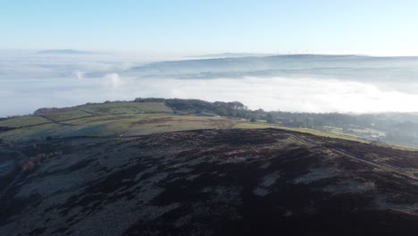 Cloudy-misty-sunrise-valley-aerial-moorland-hiking-hillside-farmland-Lancashire-pull-back
