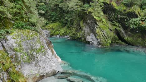 Water-erosion-formed-natural-pool-in-crystal-clear-green-river-canyon
