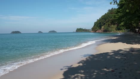 Koh-Chang,-white-sand-beach-with-islands-and-slow-motion-small-waves