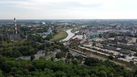 Drone-shot-of-city-Poznan,-Poland-with-river-Warta-in-the-middle