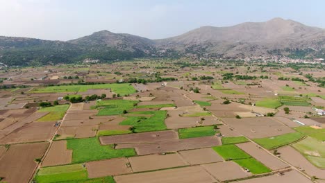 Scenic-rural-aerial-view-at-panorama-full-of-fields-and-meadows