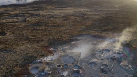 Steam-Rising-From-Geothermal-Mud-Pools-In-Reykjanes,-Iceland