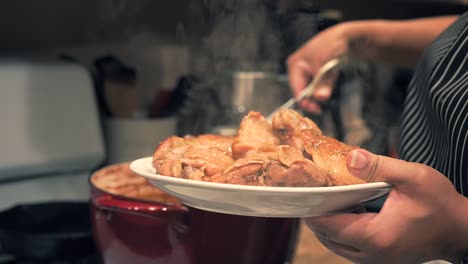 Taking-the-steaming-hot-chicken-thighs-out-of-the-Dutch-oven-to-serve---POT-ROASTED-CHICKEN-SERIES